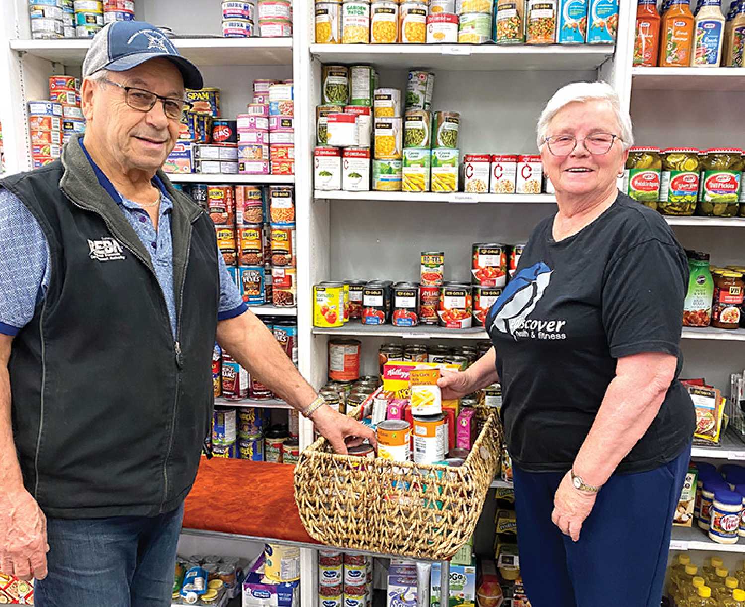 Moosomin Food Share volunteers Orey and Audrey Hudym helping to stock shelves at the food share last week.